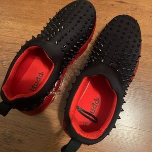 black spiked tennis shoes
